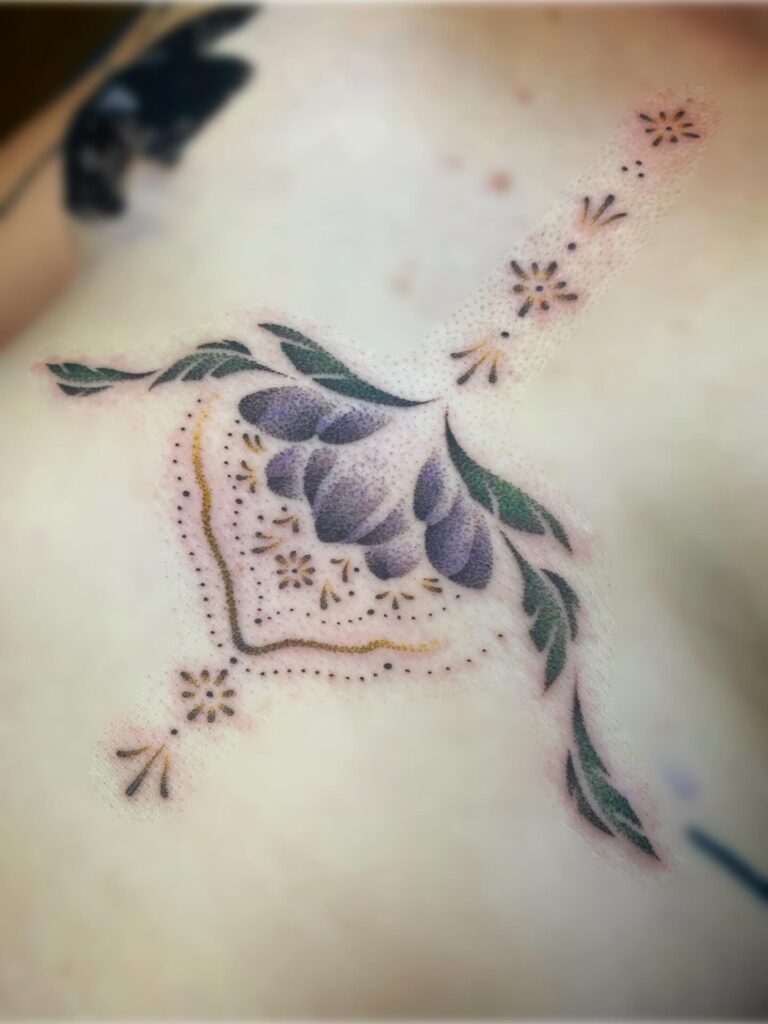 ornamentalcolourfloralsternumtattoo