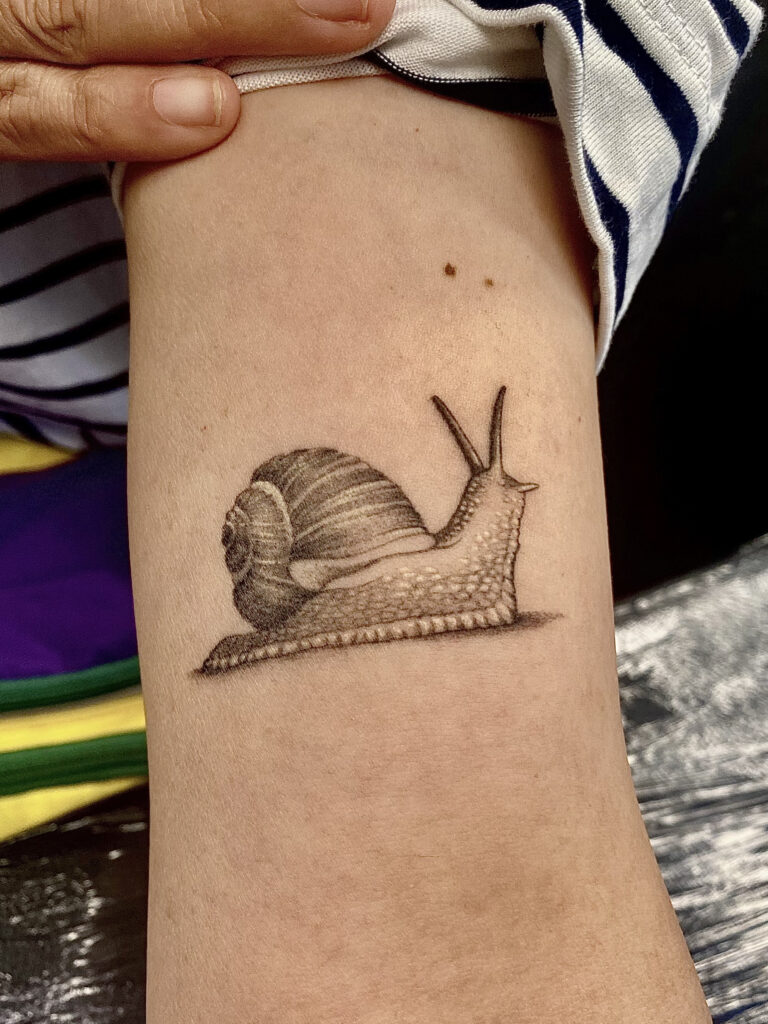 realismsmallsnailtattoo